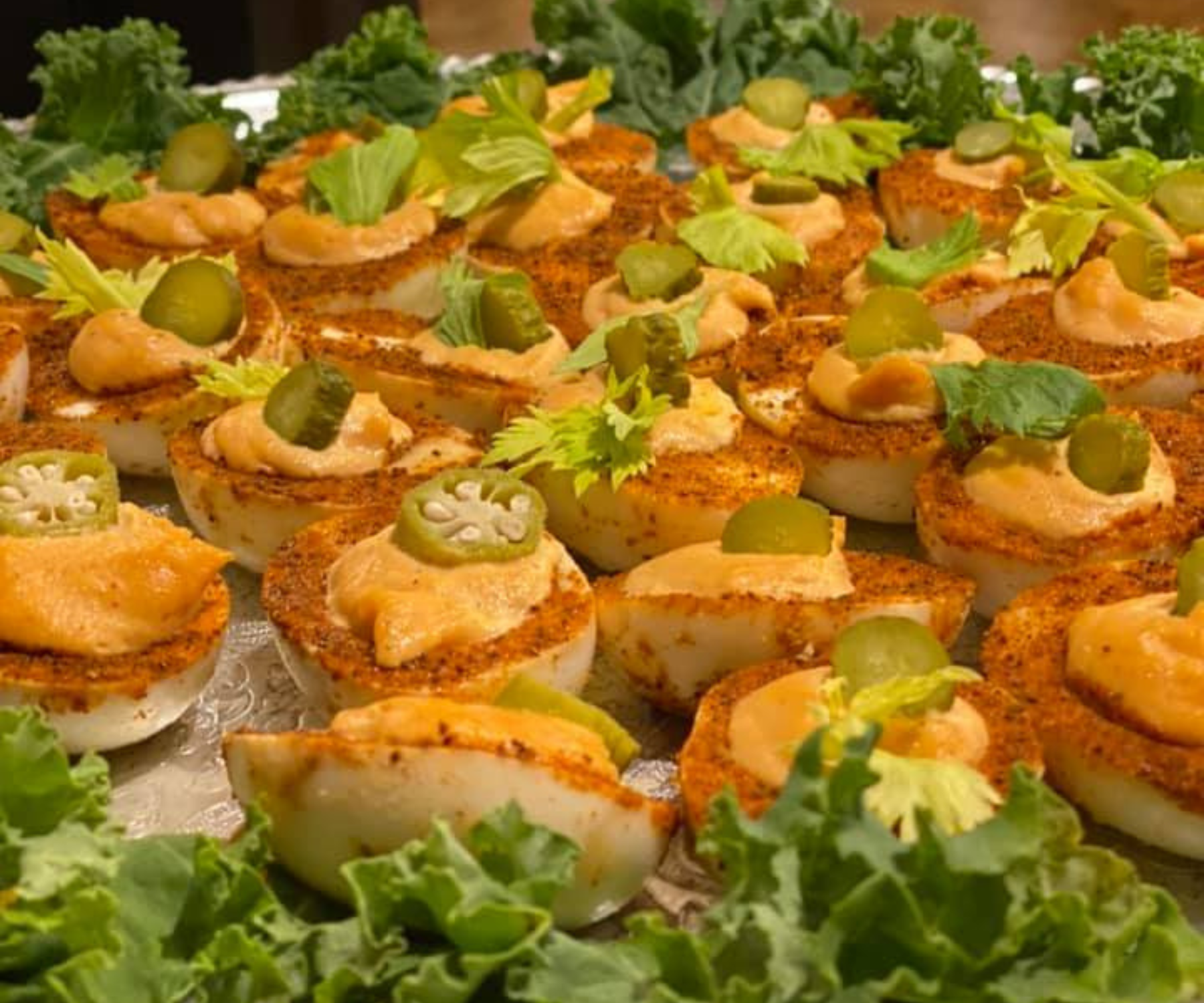 Close up of deviled eggs with paprika and sliced jalapeno at Darlington Country Club's dining area