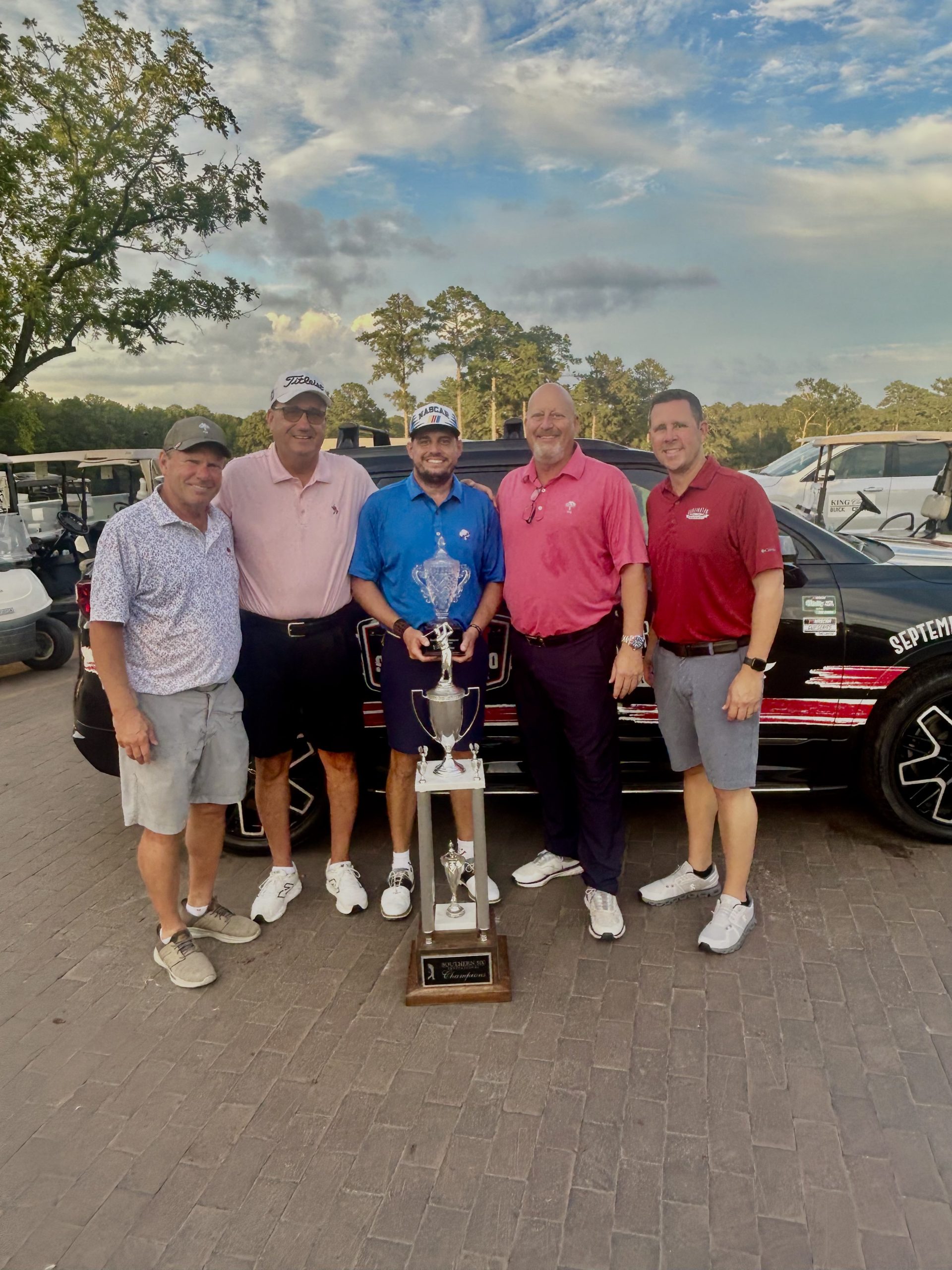 Jon Weiss Jr. receives his second straight Southern 500 Golf Invitational Trophy (left to right): Tim Huntley, Jon Weiss Sr., Jon Weiss Jr., Jim Vernon, Josh Harris